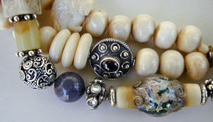 Bone, Quartz, Silver, Garnet, jasjper, serpentine, and lampwork bead necklace by Vicky Jousan
