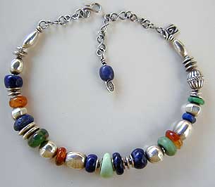 hand carved - stones by Africa John - combined with sterling silver - necklace design by Vicky Jousan