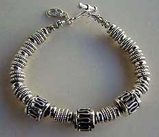 Sterling silver bracelet and earrings by Vicky Jousan