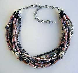 Rhodonite, black onyx, moonstone, pearls, crystal and sterling silver 9-strand Necklace by Vicky Jousan