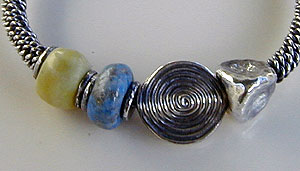 Bangle bracelet of sterling silver, lapis lazuli, and verd-antique stones - by Vicky Jousan