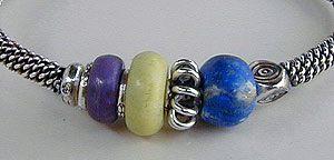 Bangle bracelet of Hill Tribe silver, Sugilite, Verd-Antique, and Lapis Lazuli stones - by Vicky Jousan