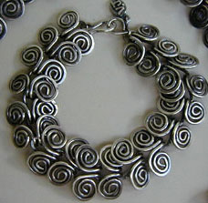 Handmade Egyptian Coil heavy gauge sterling silver necklace and matching bracelet by Vicky Jousan