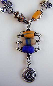 Sterling silver wire wrapped African trade bead necklace and earrings by Vicky Jousan